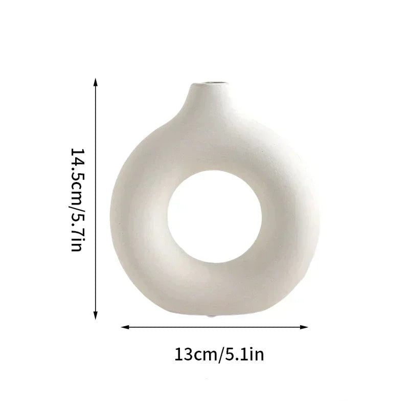 Unique donut design ceramic flowerpot, ideal for showcasing single branches or minimalist floral arrangements.
