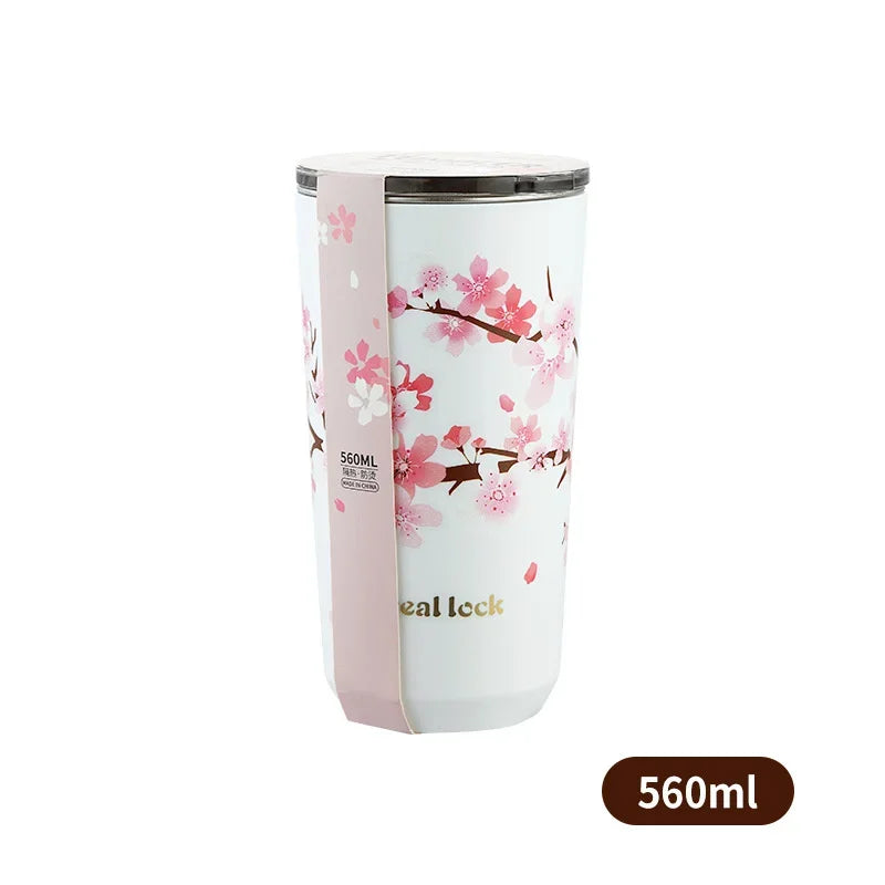 Stunning cherry blossom pattern on a stainless steel travel mug, a perfect blend of style and functionality.