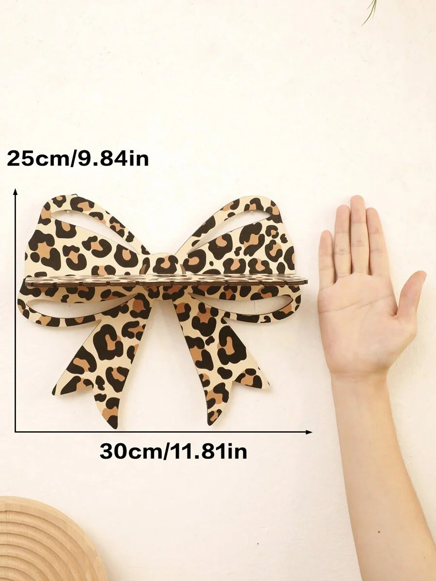 Wall-mounted leopard-print bow shelf for living rooms and bedrooms, combining storage and decoration.