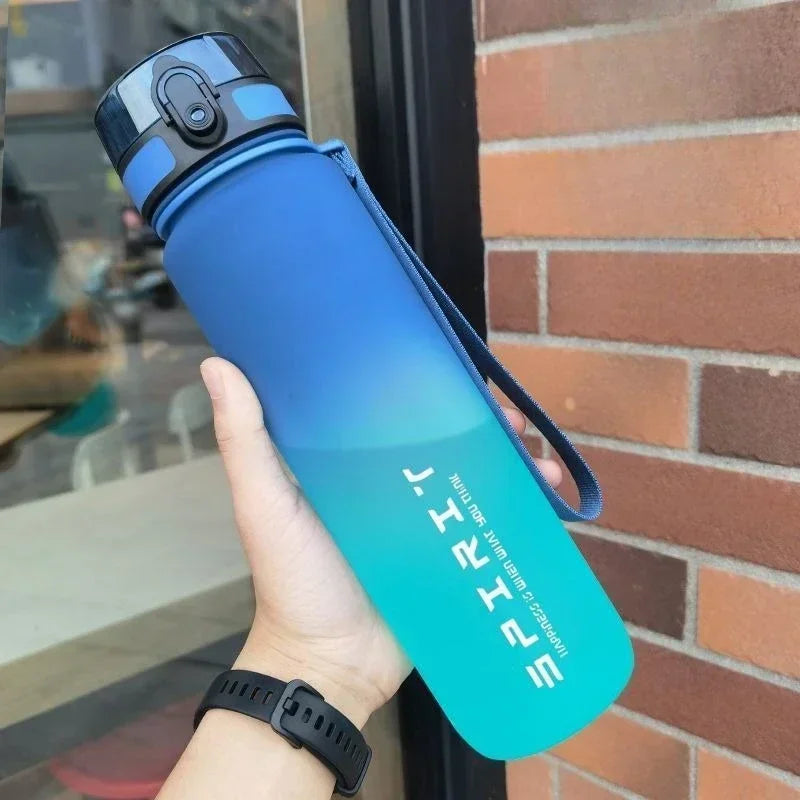 1L sports water bottle used outdoors for hiking, running, or other physical activities.