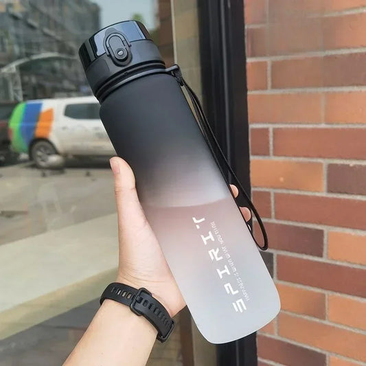 Side view of the portable 1L water bottle, showing its durable plastic construction and ergonomic shape.