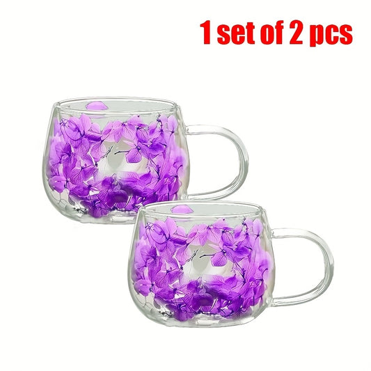 A matching pair of handmade glass coffee cups with elegant floral prints, designed for espresso or small hot drinks.