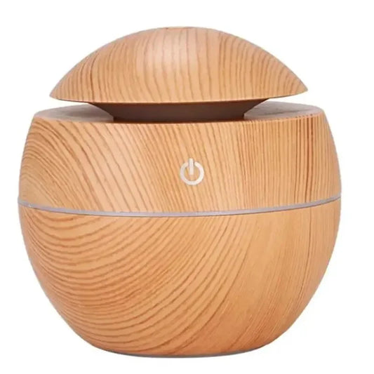 Stylish wood grain humidifier and essential oil diffuser, USB-powered for fresh air, relaxation, and hydration in bedroom or workspace.