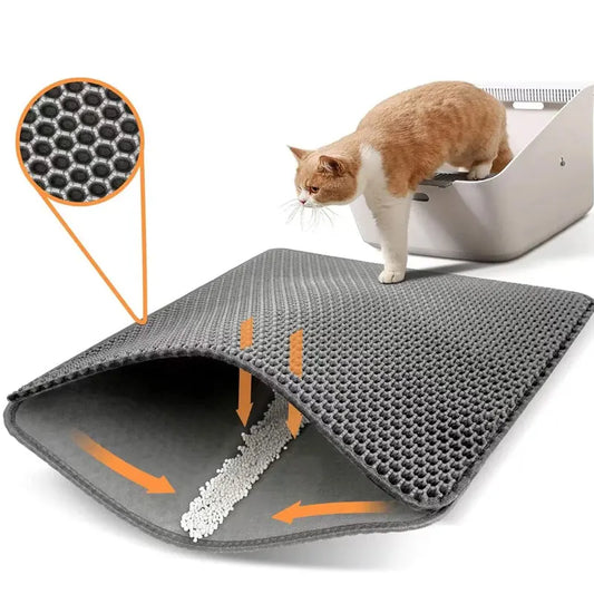 Cat standing on litter mat placed under litter box