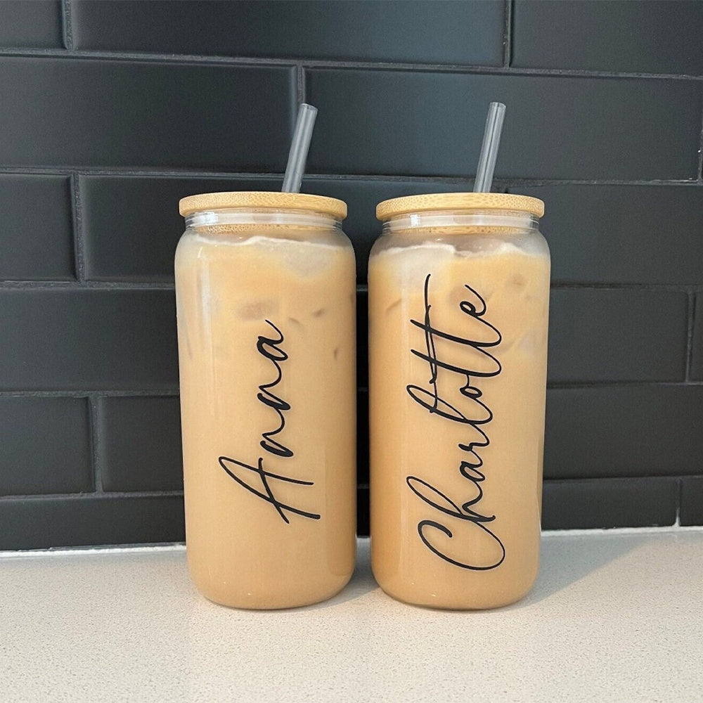 Front view of custom engraved glass tumbler with lid and straw, personalized for iced coffee