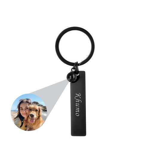 Side view of alphabet-themed stainless steel keychain with engraved initials.