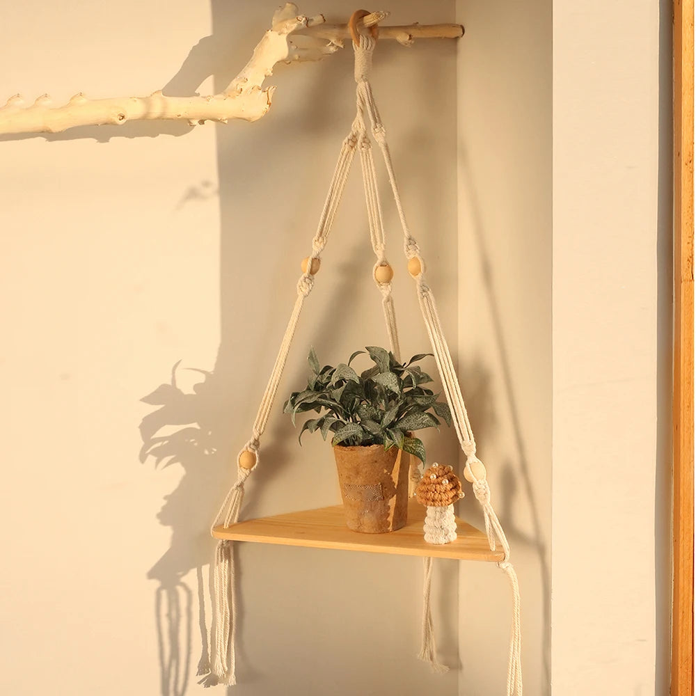 Floating corner shelf with macrame design, showcasing minimalist boho decor and home organization.
