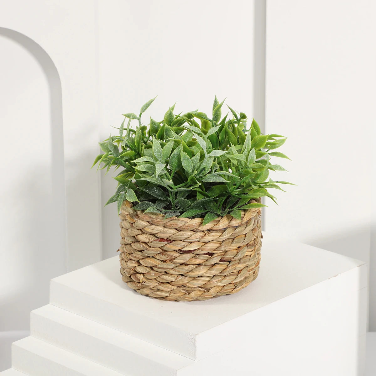 XIYA artificial plant displayed on a desk, enhancing home or office with greenery.