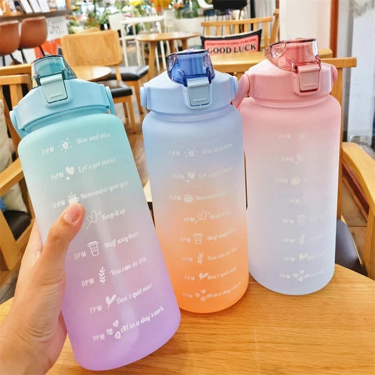 Front view of the 2L sports water bottle with leakproof design, bounce cover, built-in straw, and time marker for daily hydration.