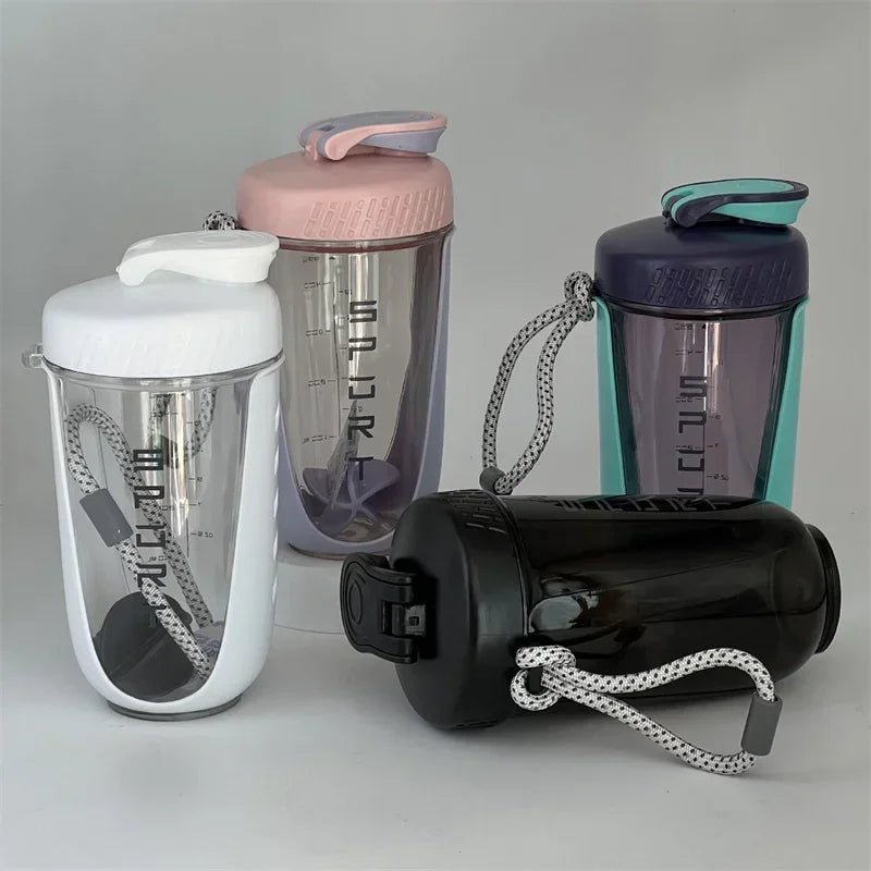 Shaker bottle with a plastic whisk ball for smooth protein shake mixing. Leakproof design for easy use on-the-go.


