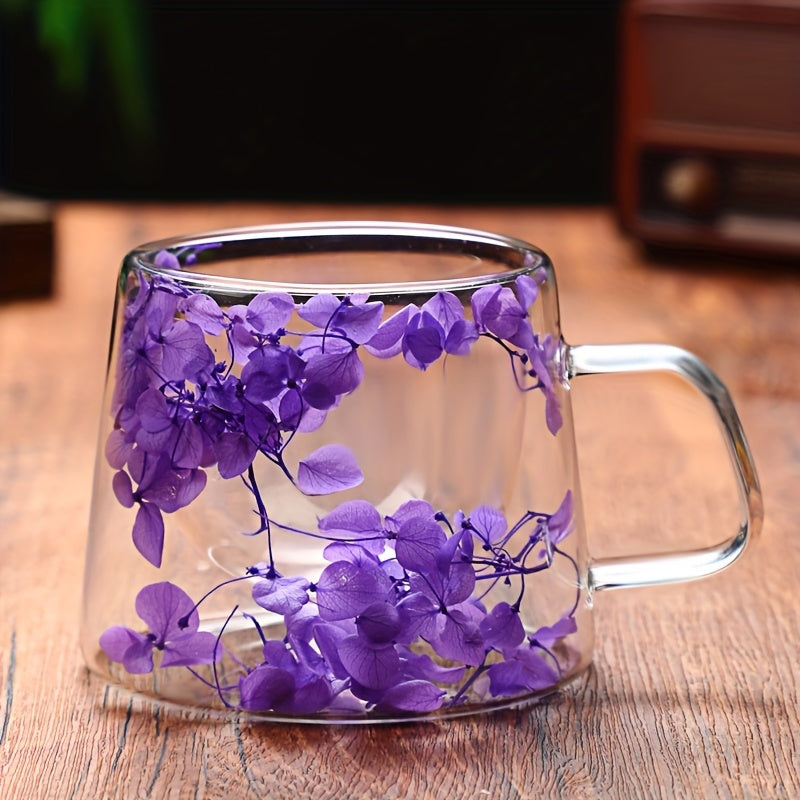 Showcase of the beautiful 7oz double-walled glass mug featuring a real flower design, ideal for enjoying tea, coffee, or milk with a stylish touch.
