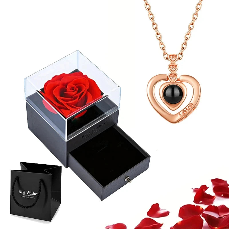 Elegant heart pendant necklace combined with a luxurious rose box for a complete romantic gift.