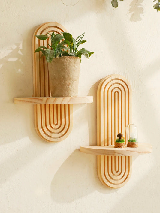 Geometric wooden wall-mounted shelf with a boho design, perfect for displaying plants, decor, and personal items in living rooms or bedrooms.