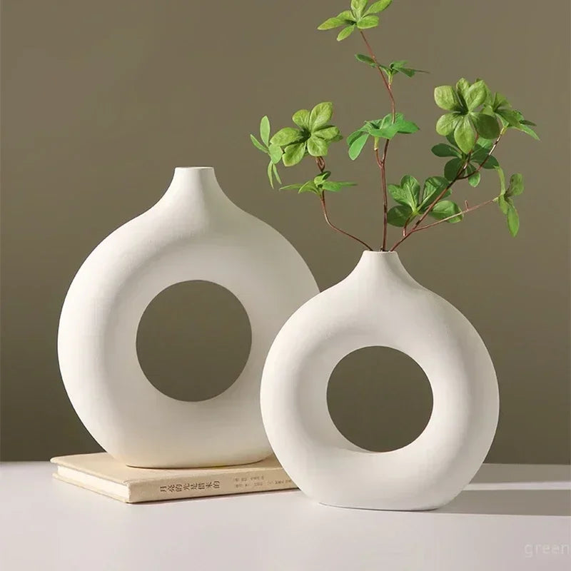Elegant imitation ceramic white vase with a donut design, perfect for single branch flower arrangements.