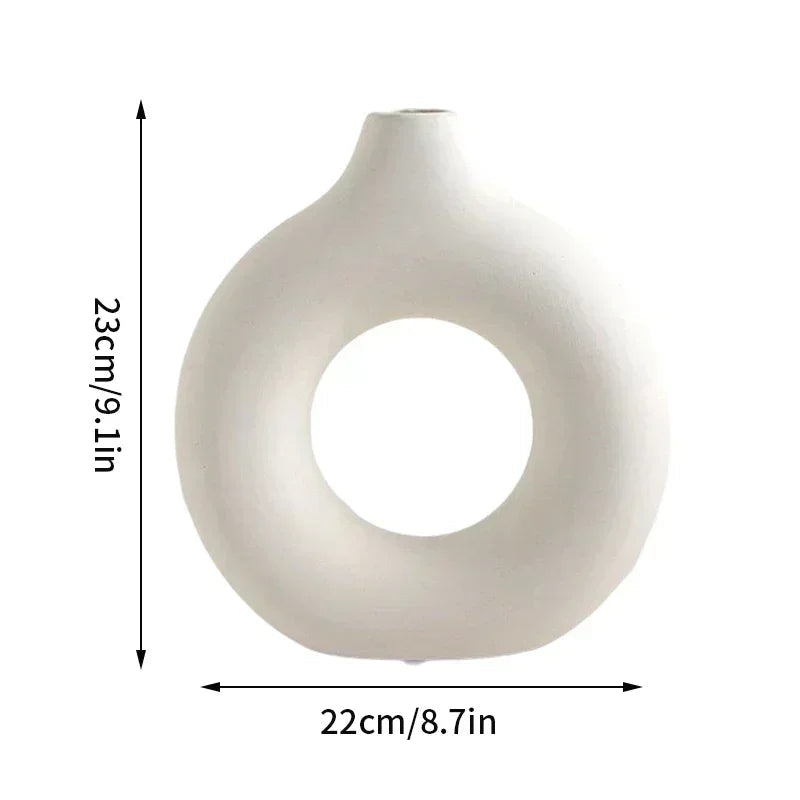 Elegant minimalist white flowerpot with donut design, perfect for modern home decor.