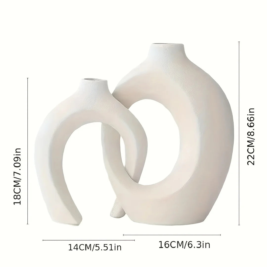 set of 2 minimalist Nordic ceramic vases with hollow interiors, perfect for displaying stems, flowers, or as stand-alone decorative pieces