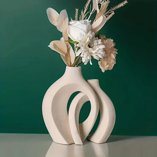 Elegant set of 2 modern ceramic vases with hollow design, ideal for decorating living rooms, bookshelves, and tabletops.