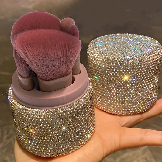 A stylish set of soft makeup brushes stored in a glittery bucket with a rhinestone lid, perfect for organizing powder, eyeshadow, and foundation brushes.
