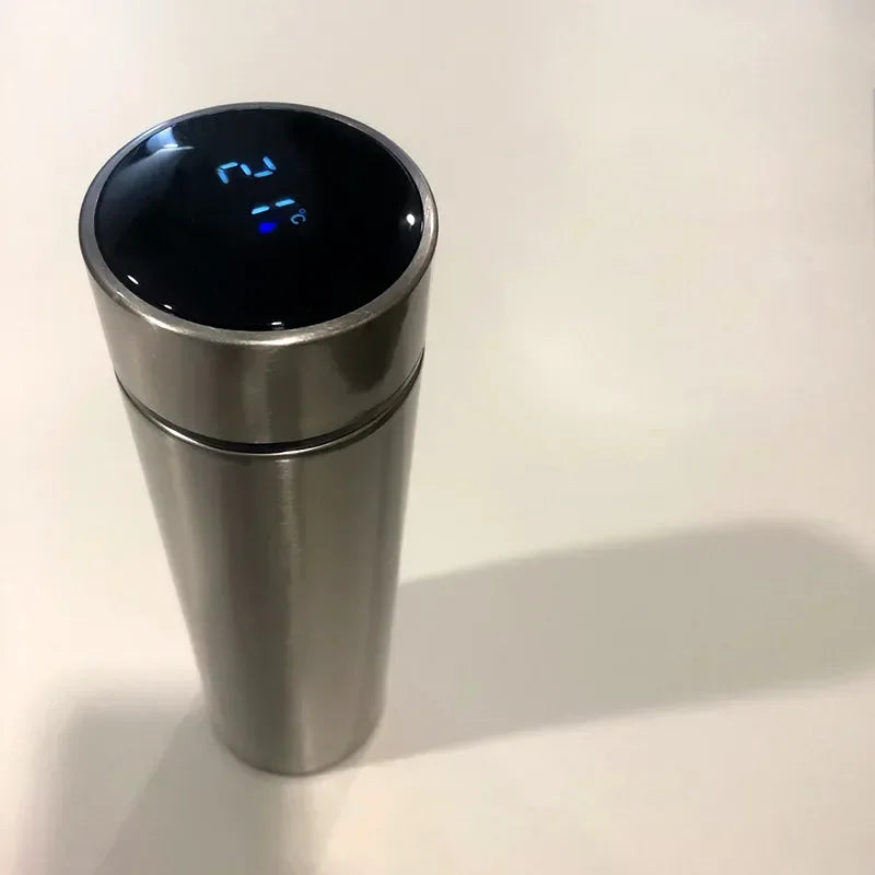 Stainless steel vacuum flask with LED temperature display, designed for convenient hydration during travel and daily commuting.

