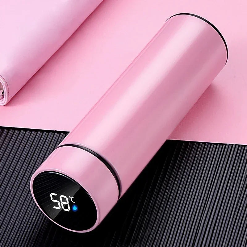 Close-up of modern, minimalist insulated vacuum flask design with smooth finish and smart LED display on the lid