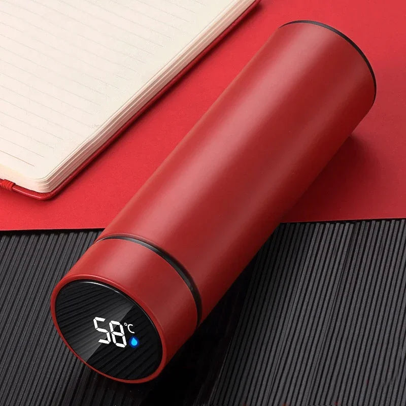 Smart LED insulated vacuum flask on a desk, perfect for office, home, sports, and outdoor hydration with stylish design