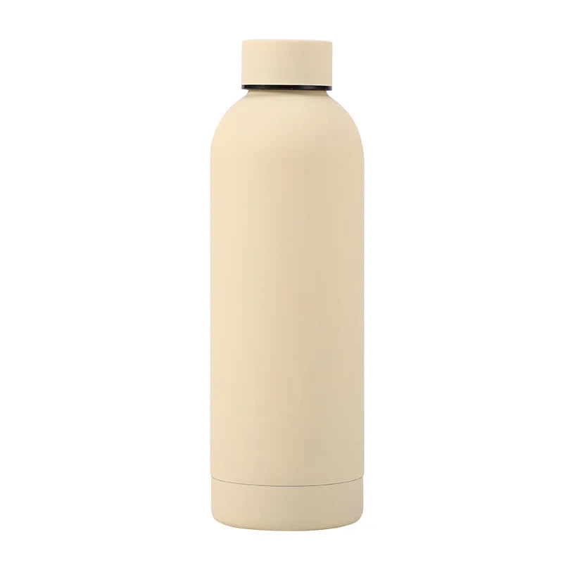 Lightweight stainless steel thermos bottle held in hand, designed for easy portability and comfortable grip