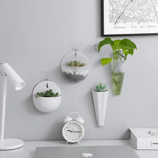 Wall-mounted plastic hydroponic vase in a modern design, perfect for indoor and outdoor plant decoration.