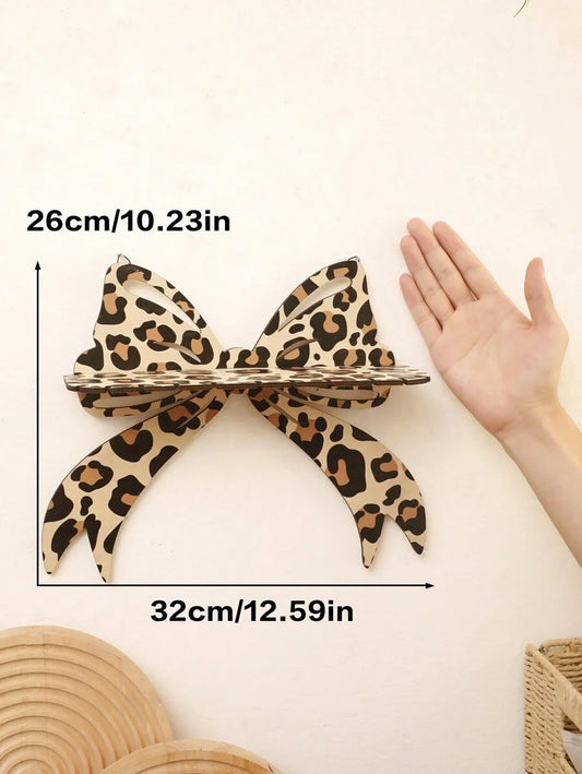 Decorative leopard bow wall stand shelf, ideal for storage and showcasing handicrafts in modern interiors.
