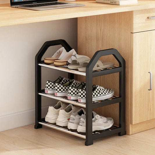 Front view of multi-tier shoe rack organizer with shoes, hats, and coats neatly arranged