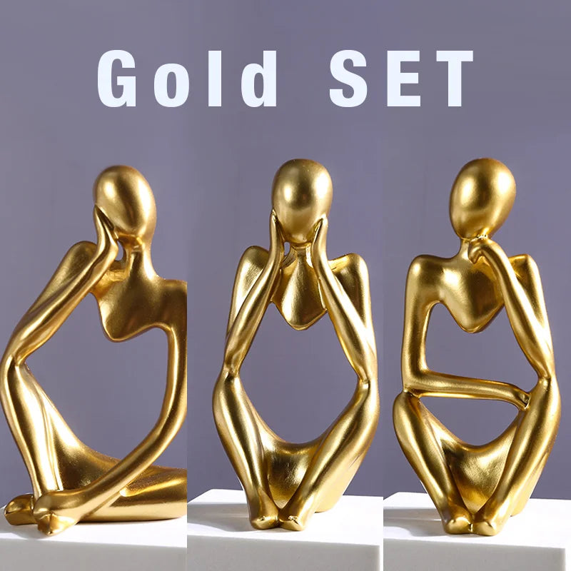 Set of abstract sand-colored statues arranged together for modern interior decor